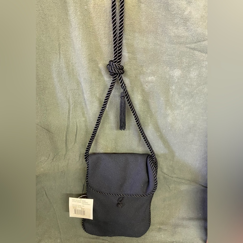 Kenneth Cole “Evening Treasure” black purse with braided rope strap.